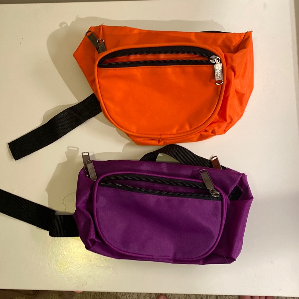 Two old school fanny packs. One never used the other used maybe twice.